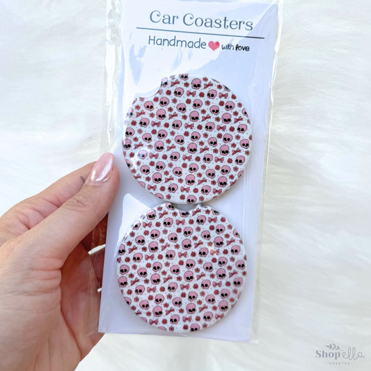 a package of car coasters in a package pink skulls and bows