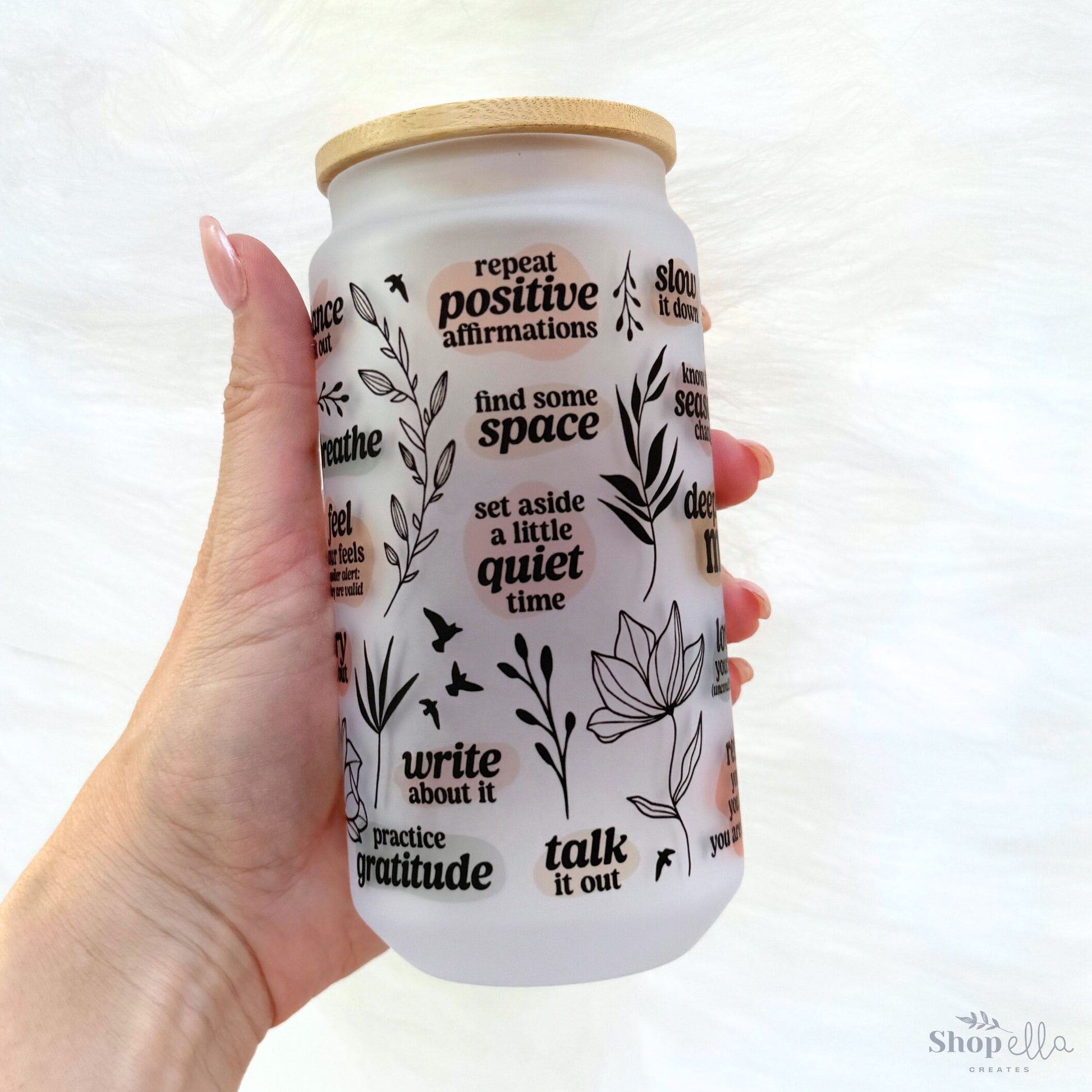a hand holding a jar of white stuff