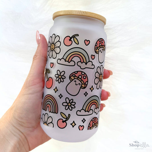 cute cottagecore pattern on 18oz glass cup with bamboo lid. rainbow, cherries, smiling daisies, happy mushrooms, stars, hearts