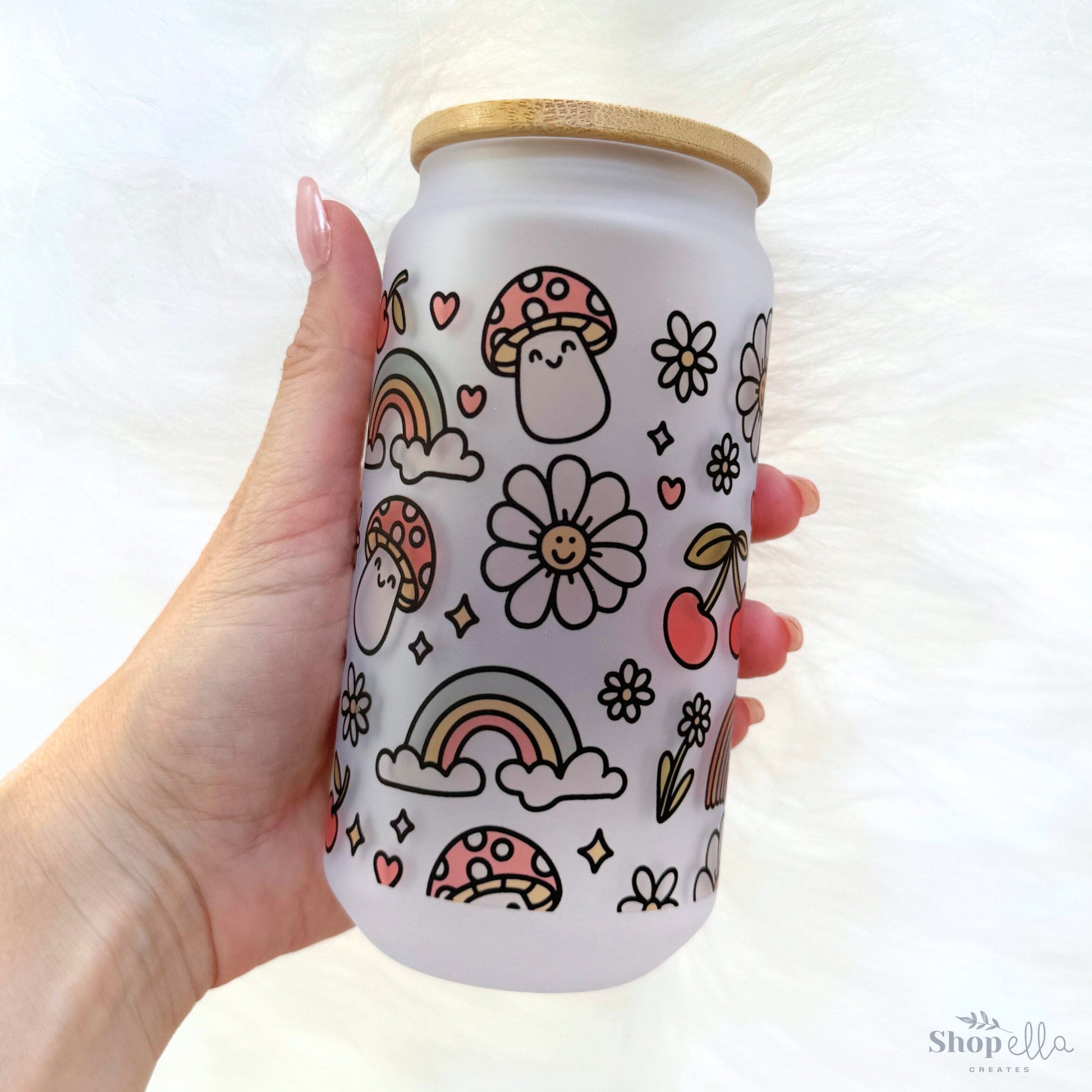 a hand holding a can with a pattern on it
