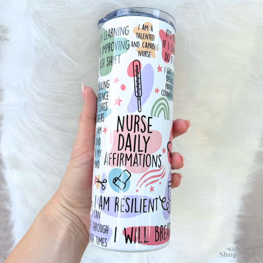a woman holding a white tumbler cup with words all over it