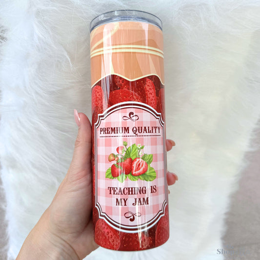 a person holding a can of strawberry jam