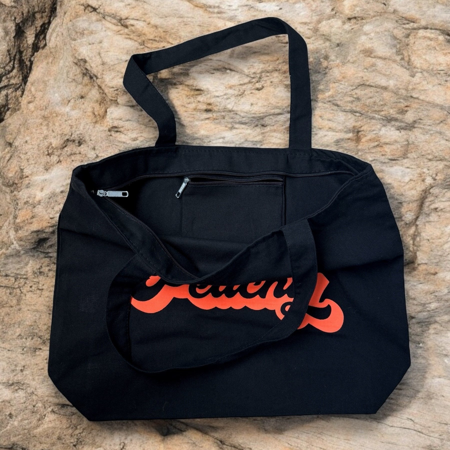 just peachy black tote bag showing zippered compartments
