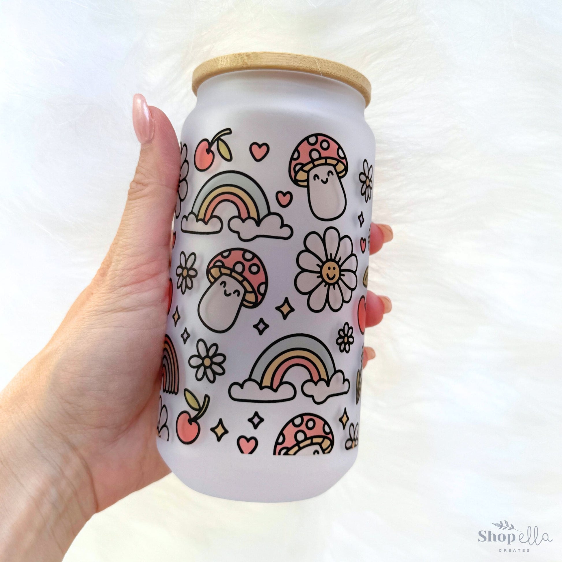 a hand holding a can with a pattern on it